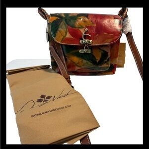 Patricia Nash cross body Leandra bag.  NWT with dust bag approx 9x9x5